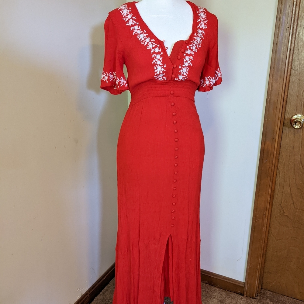 Orange maxi dress with floral lace accents